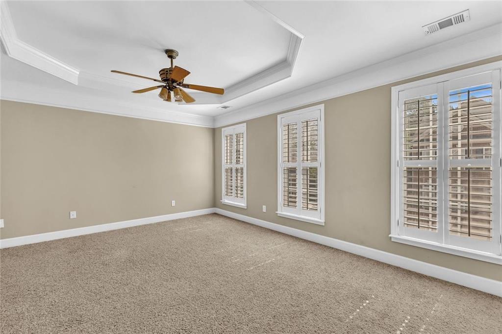 4888 Colchester Court, Unit 163 Atlanta, GA 30339 - Photo 24 of 44 a view of a livingroom with a ceiling fan and window