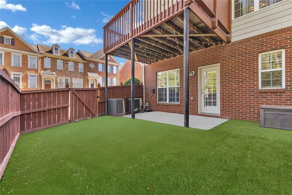 4888 Colchester Court, Unit 163 Atlanta, GA 30339 - Photo 32 of 44 a view of a house with a yard and sitting area