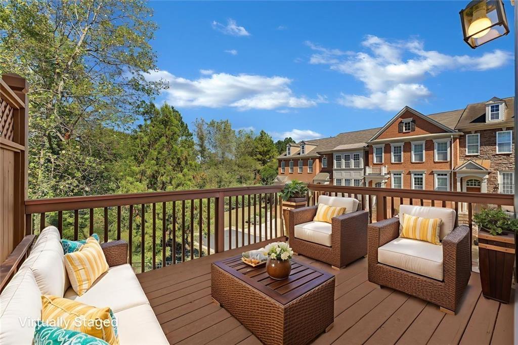 4888 Colchester Court, Unit 163 Atlanta, GA 30339 - Photo 5 of 44 a balcony with furniture and wooden floor