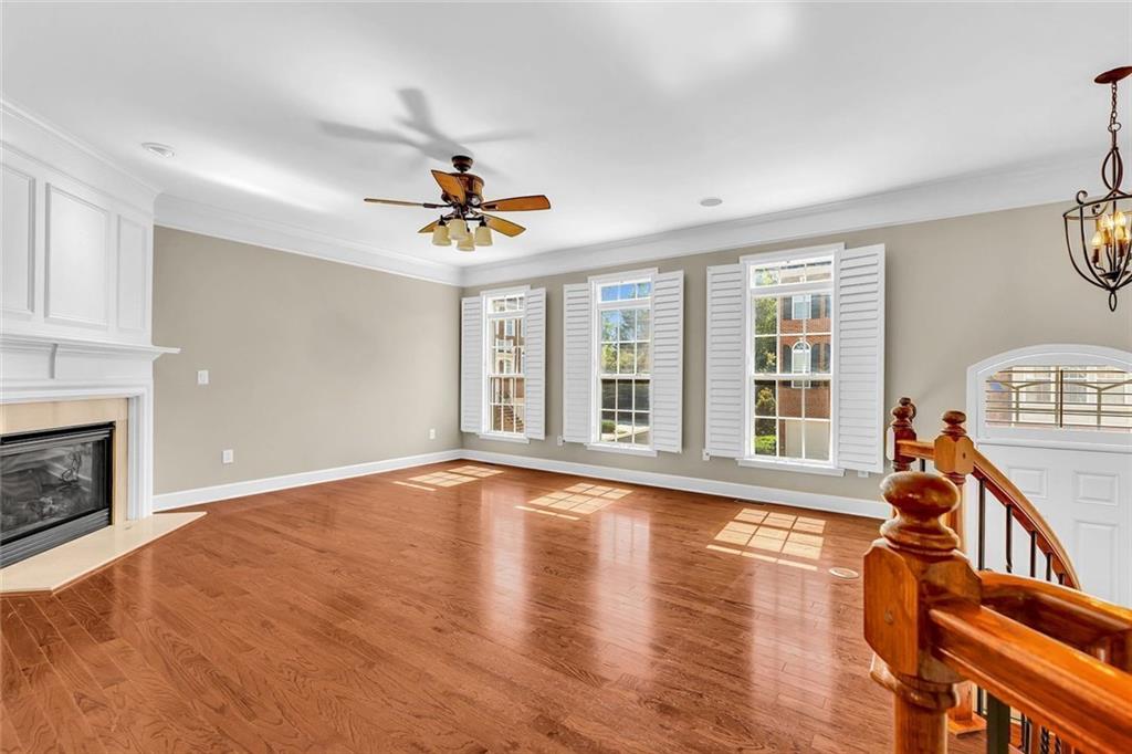 4888 Colchester Court, Unit 163 Atlanta, GA 30339 - Photo 9 of 44 a view of an empty room with window and wooden floor