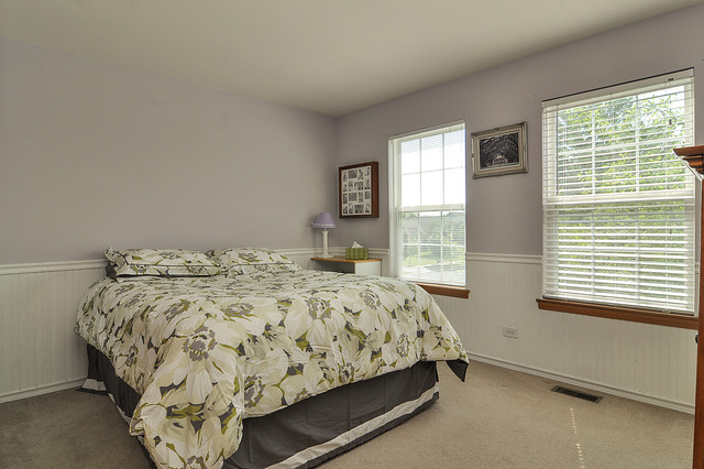1056 Teasel Lane Aurora, IL 60504 - Photo 16 of 25 a bedroom with a bed and window