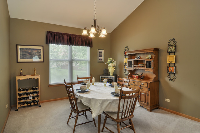 1056 Teasel Lane Aurora, IL 60504 - Photo 8 of 25 a view of a dining room with furniture window and outside view