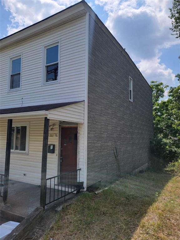 3221 Minnie Street Pittsburgh, PA 15212 - Photo 2 of 18 a front view of a house with a yard