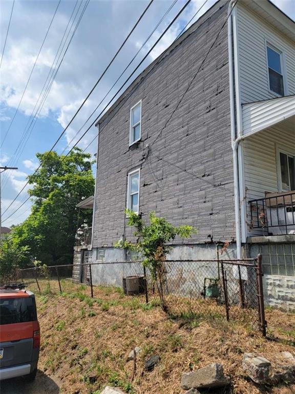 3221 Minnie Street Pittsburgh, PA 15212 - Photo 3 of 18 a backyard of a house with chairs