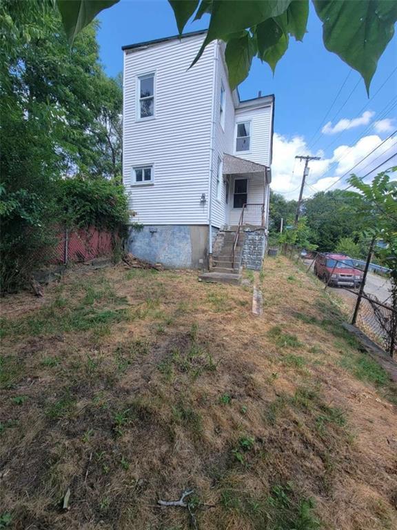 3221 Minnie Street Pittsburgh, PA 15212 - Photo 6 of 18 a view of a house with a yard and sitting area