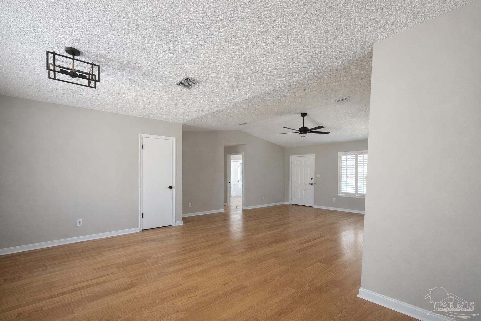 2360 Old Chemstrand Road Cantonment, FL 32533 - Photo 5 of 11 wooden floor in an empty room