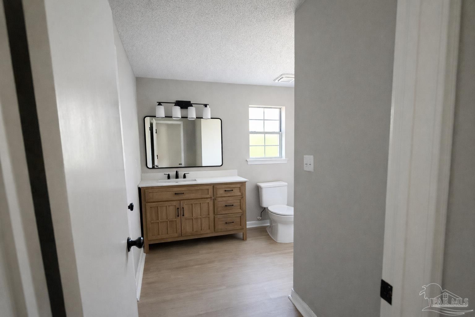 2360 Old Chemstrand Road Cantonment, FL 32533 - Photo 8 of 11 a room with a sink and a mirror