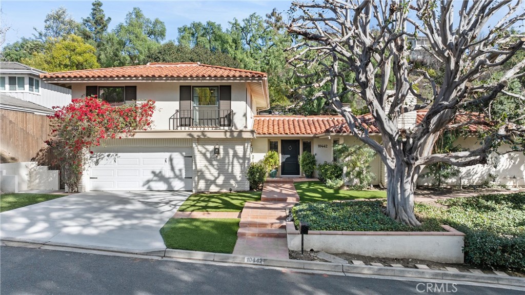 10442 Boca Canyon Drive North Tustin, CA 92705 - Photo 5 of 55 a front view of a house with a garden