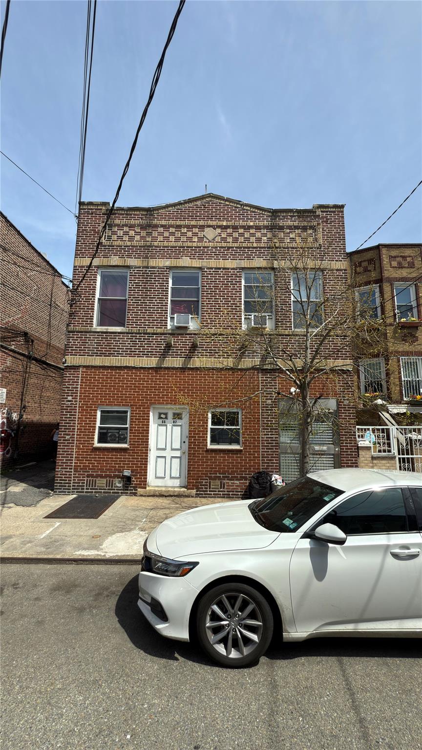 55-07 103rd Street Queens, NY 11368 - Photo 1 of 10 View of front of home featuring brick siding and cooling unit