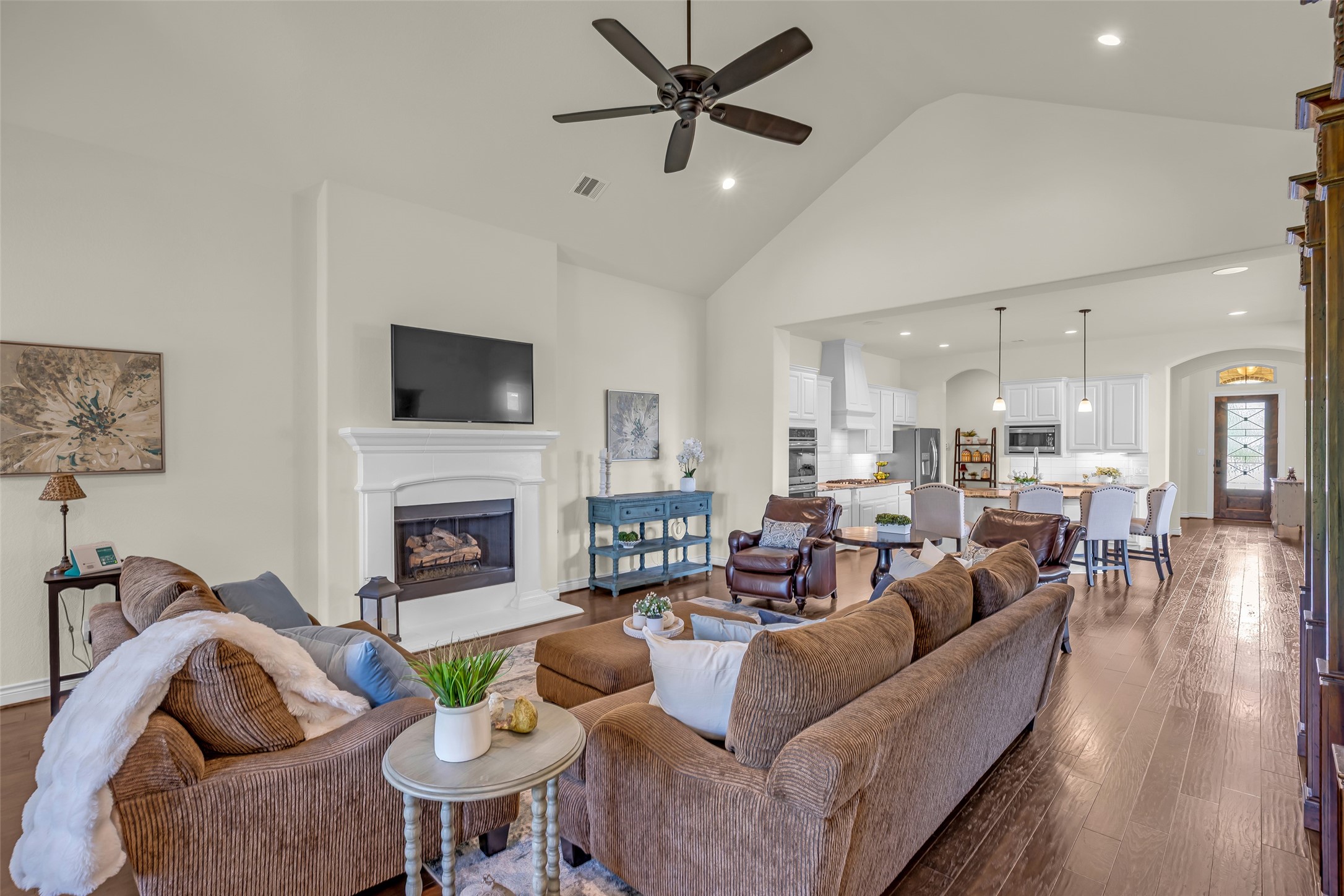 14003 South Evergreen Ridge Court Conroe, TX 77384 - Photo 15 of 43 Family room opens to the kitchen, creating a spacious gathering place for everyday living.