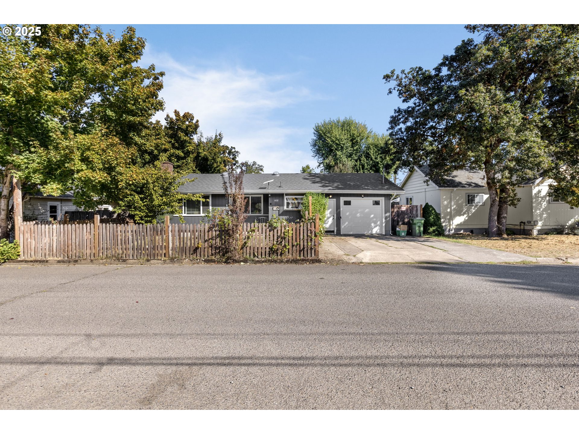 a front view of a house with a street