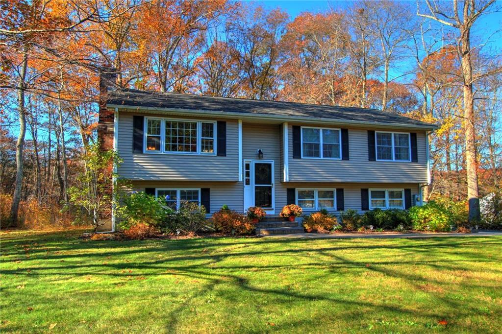 63 Webster Road East Lyme, CT 06333 - Photo 1 of 1 a front view of a house with a swimming pool