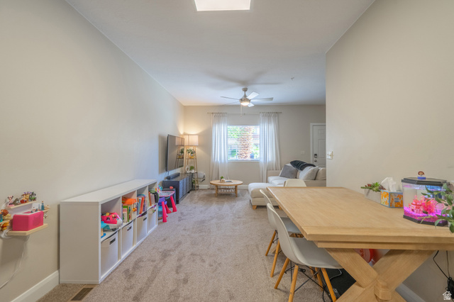 700 North Main Street, Unit F3 Washington, UT 84780 - Photo 14 of 34 Open-concept living space featuring neutral wall tones, carpeted flooring, and recessed ceiling lighting