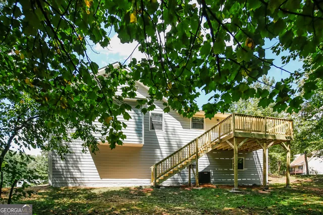 a view of a house with a tree