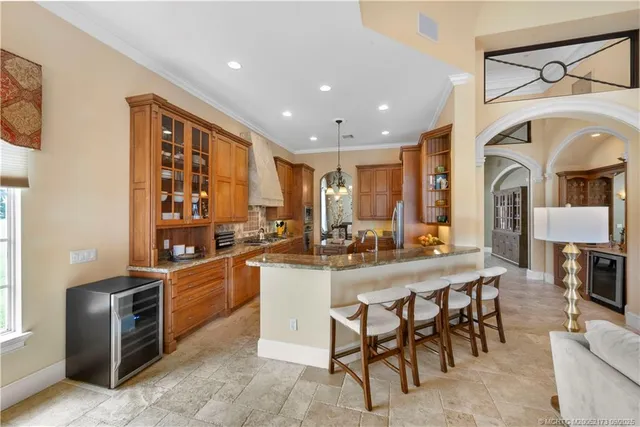 a hallway with couches and a potted plant