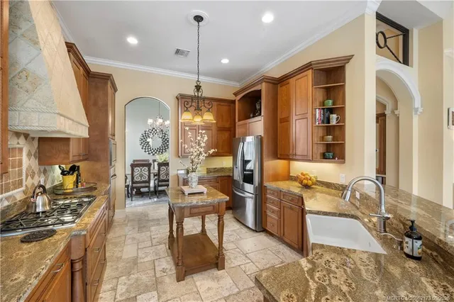 a bedroom with a bed and large windows