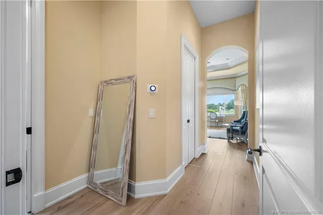 a spacious bathroom with a tub sink and mirror