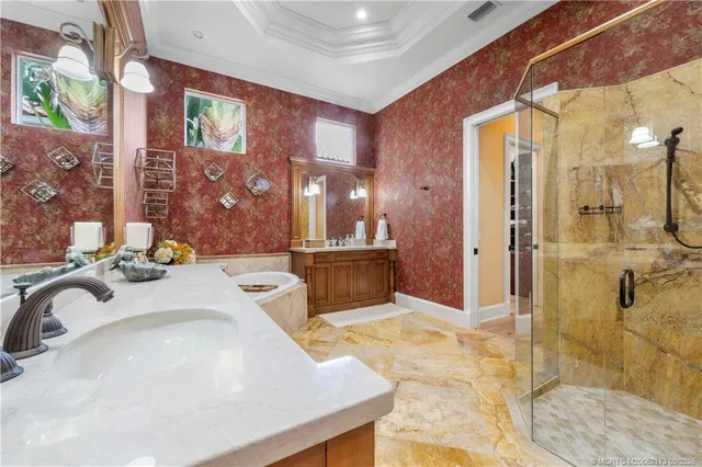 a bathroom with a double vanity sink mirror and toilet