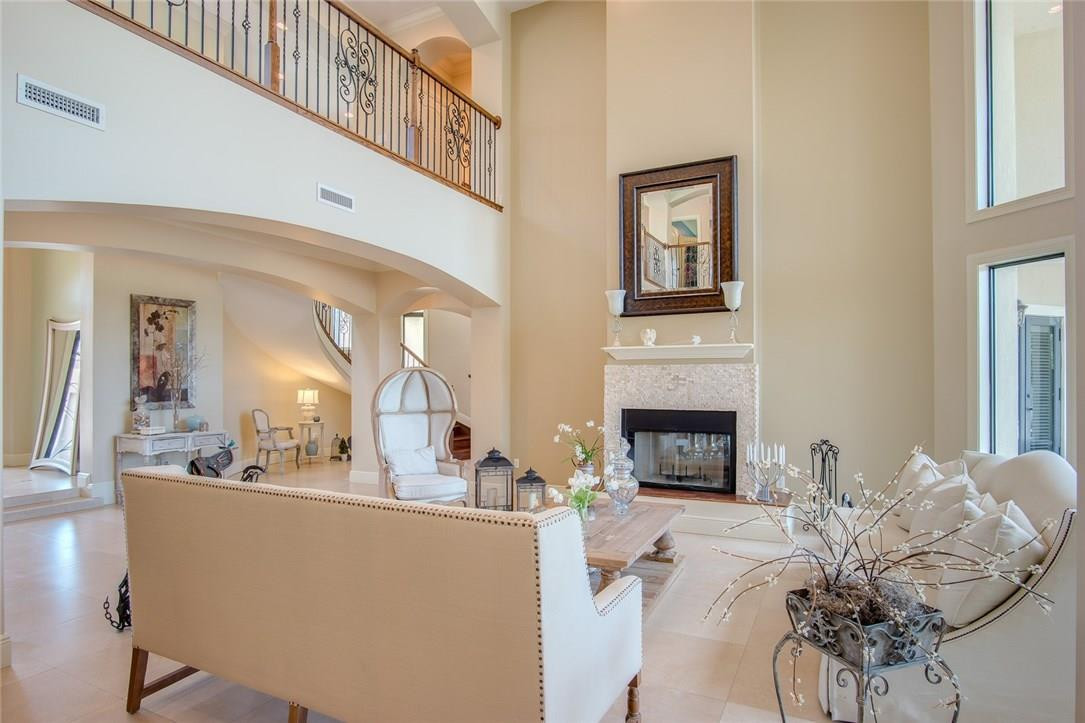 18091 Southwest 66th Street Southwest Ranches, FL 33331 - Photo 21 of 35 a living room with furniture a fireplace and a chandelier