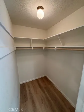 a view of a room with shelf on the wall