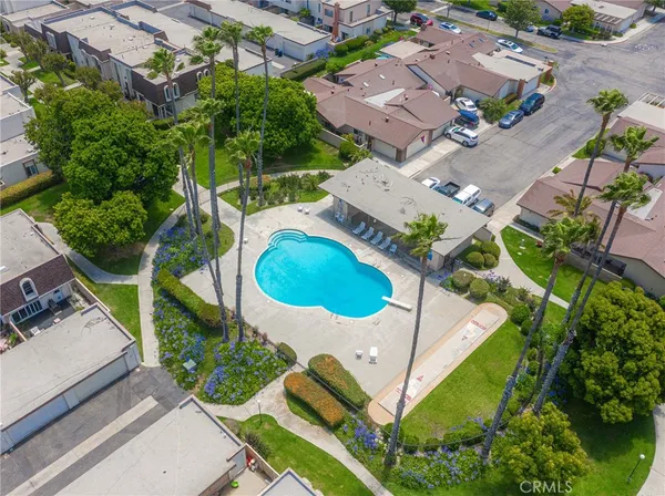 an aerial view of a house with garden space and street view