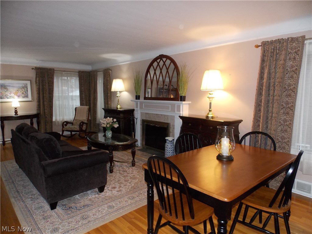 6299 South Canterbury Road Parma, OH 44129 - Photo 2 of 26 Spacious charming living room with a striking fireplace as it's focal point.