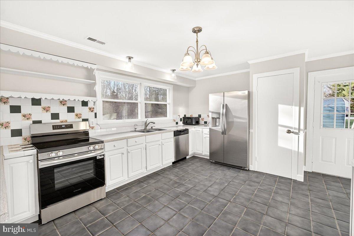 6918 Woodville Road Mount Airy, MD 21771 - Photo 15 of 46 Bright and inviting kitchen with modern charm.