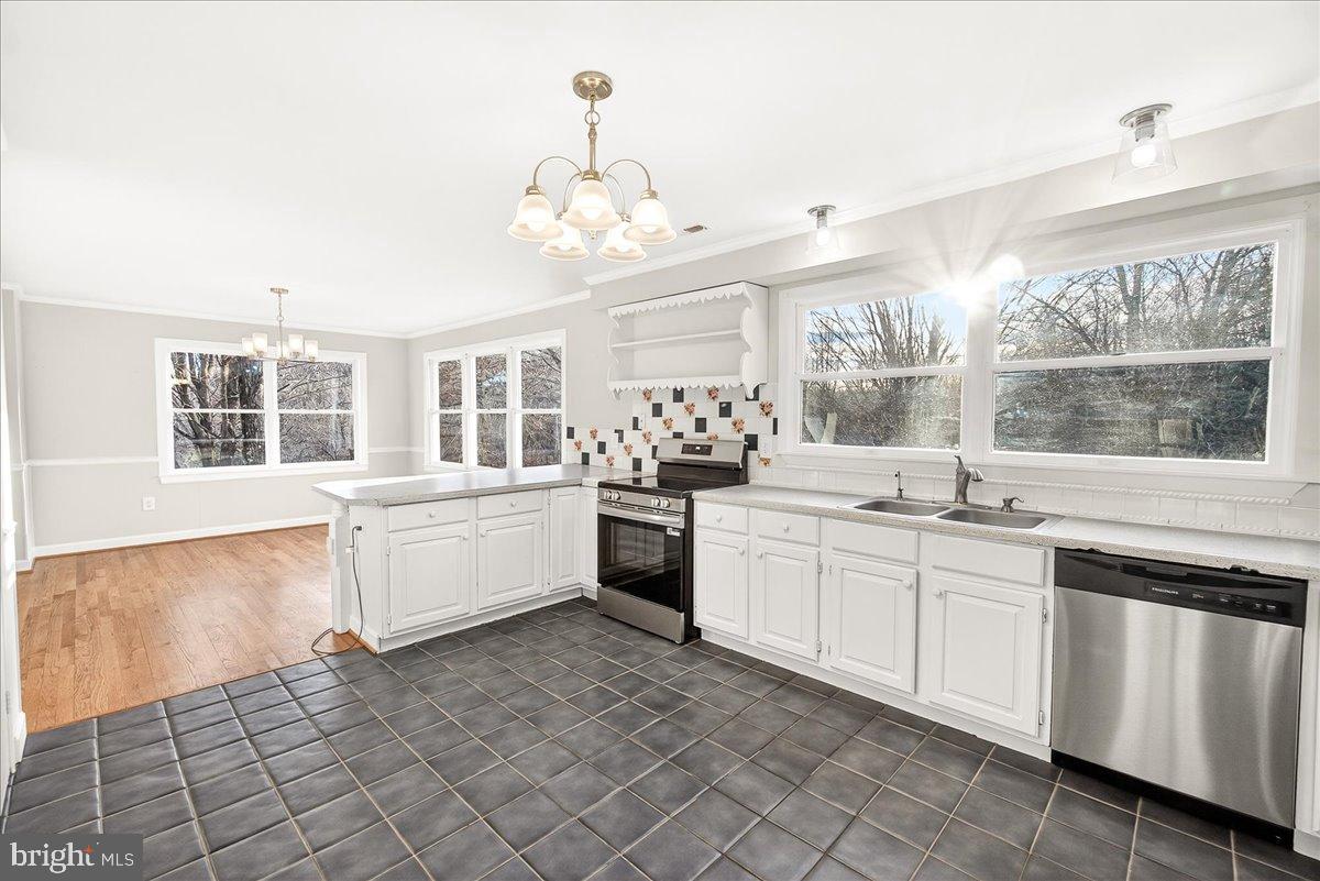6918 Woodville Road Mount Airy, MD 21771 - Photo 18 of 46 Bright and airy kitchen with modern finishes.