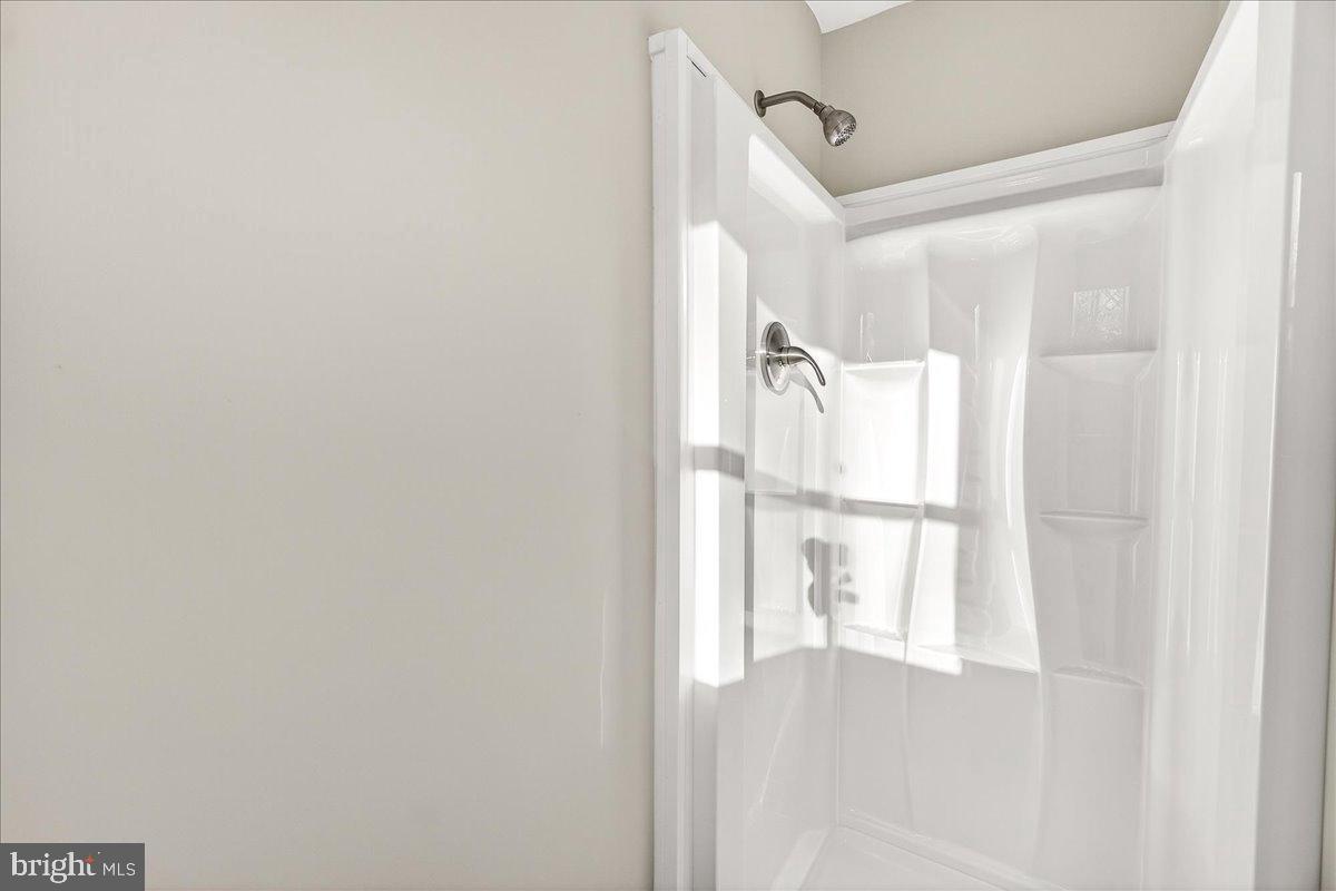 6918 Woodville Road Mount Airy, MD 21771 - Photo 26 of 46 Modern shower space with sleek design.