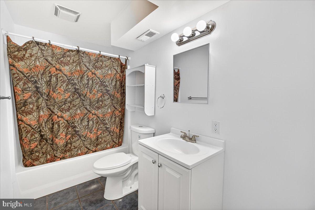 6918 Woodville Road Mount Airy, MD 21771 - Photo 32 of 46 Charming bathroom with rustic camouflage accents.
