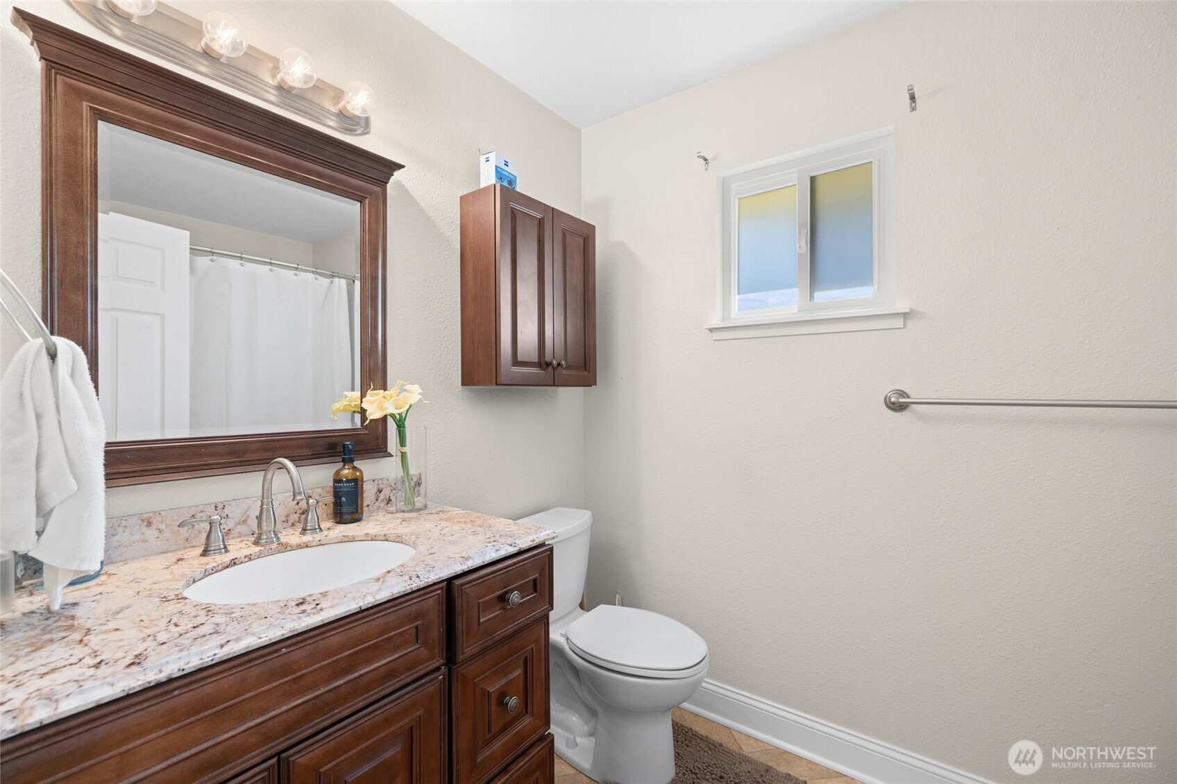 415 Sterling Street Sedro-Woolley, WA 98284 - Photo 12 of 38 a bathroom with a granite countertop sink toilet and mirror