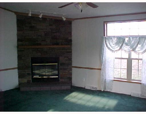 236 Stein Road Chicora, PA 16025 - Photo 5 of 6 Den/Family/Great Room. FAMILY ROOM IS RIGHT OFF THE KITCHEN-CARPETED,FIREPLACE & HAS NICE VIEW