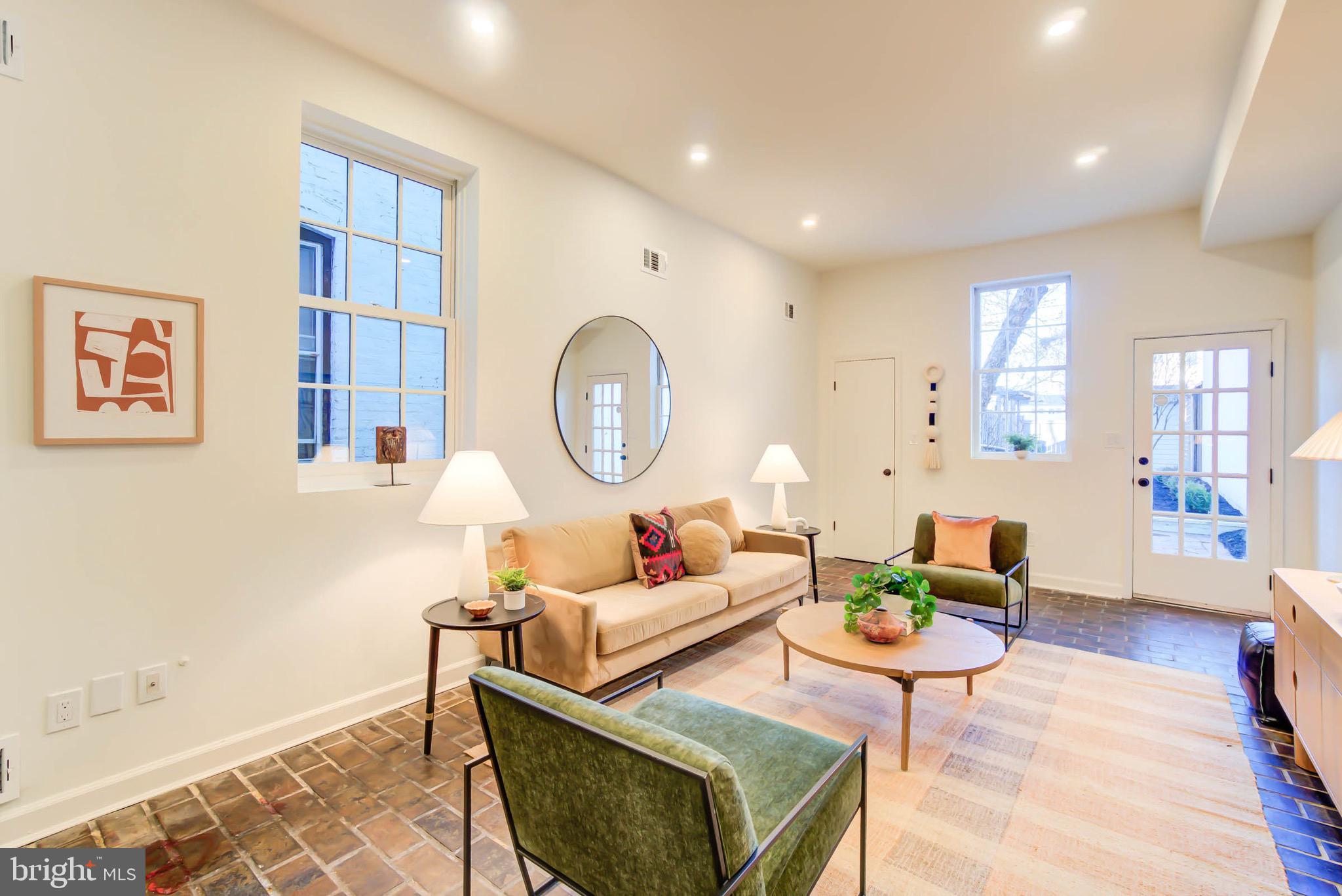 240 14th Street Southeast Washington, DC 20003 - Photo 11 of 14 a living room with furniture a rug and a window