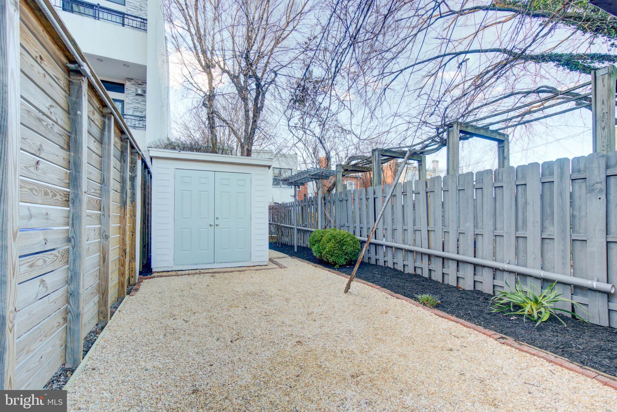 240 14th Street Southeast Washington, DC 20003 - Photo 14 of 14 a view of a backyard with wooden fence