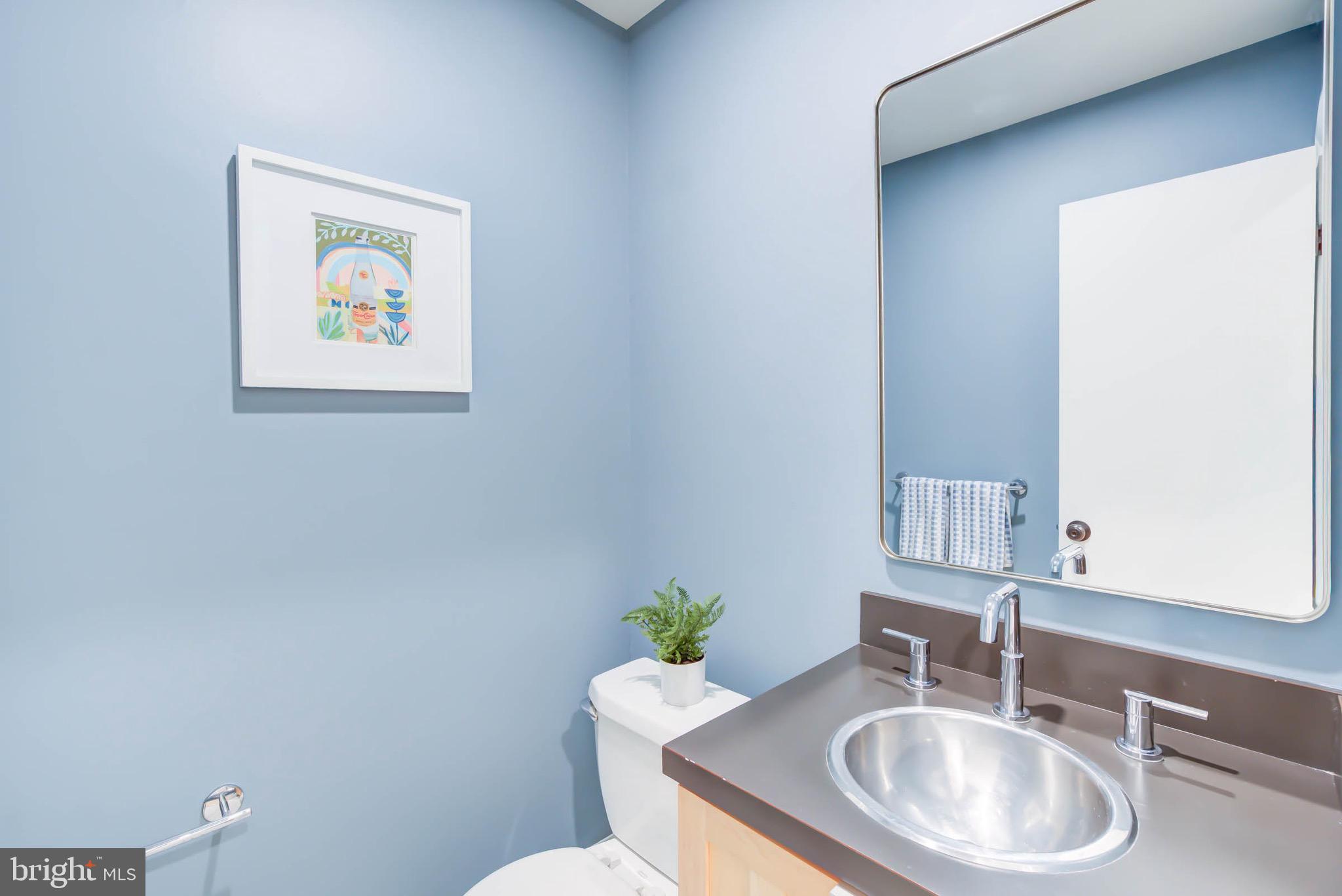 240 14th Street Southeast Washington, DC 20003 - Photo 6 of 14 a bathroom with a sink and a toilet