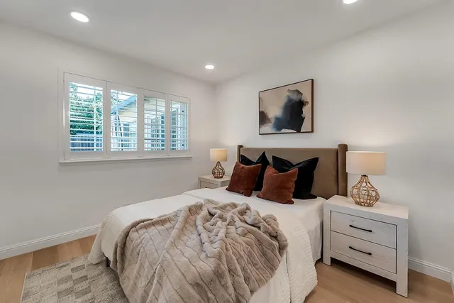 a bedroom with bed and window