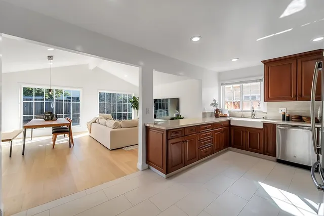 a kitchen with a sink stove and microwave