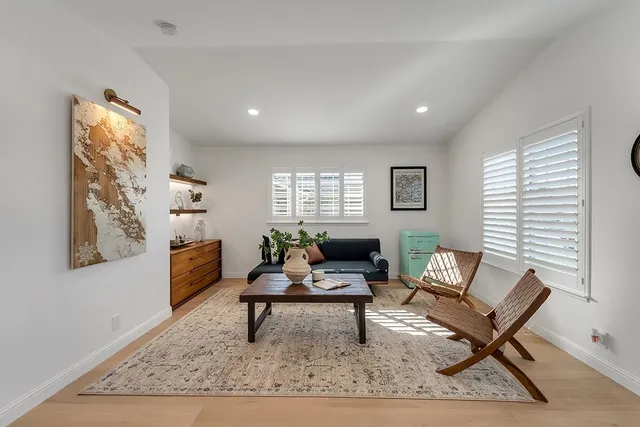 a living room with furniture and a rug