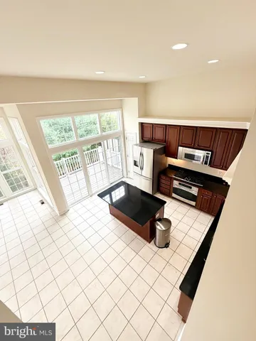 a living room with a large bed and a large window