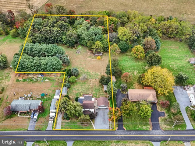 an aerial view of house with yard