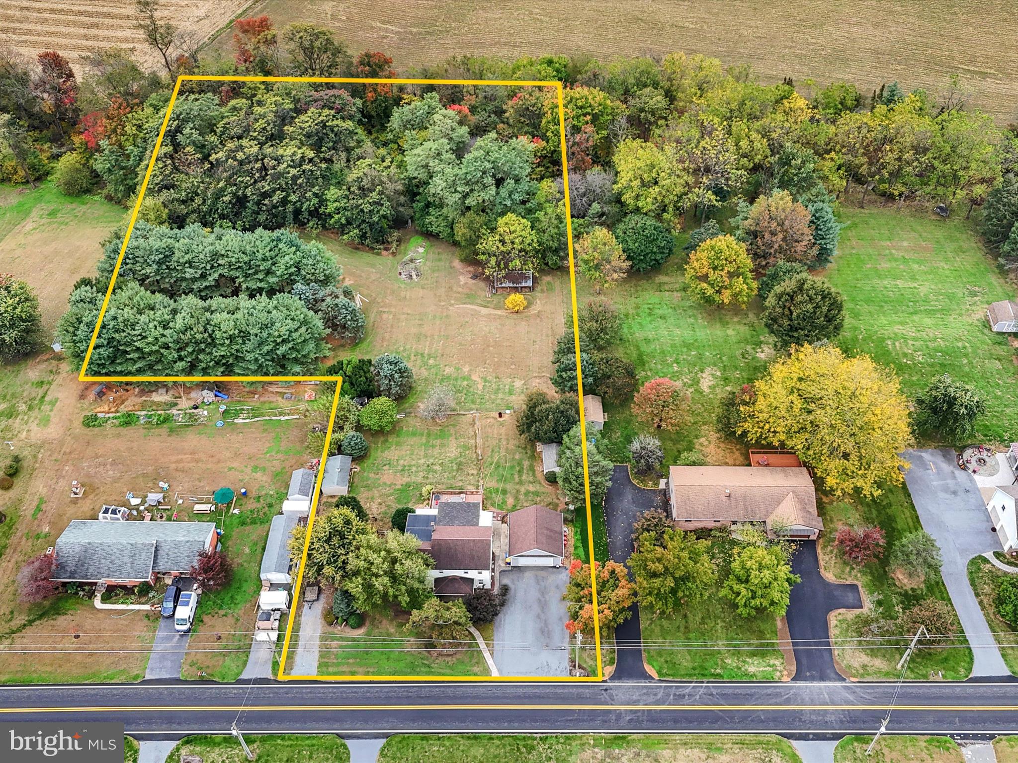 an aerial view of house with yard