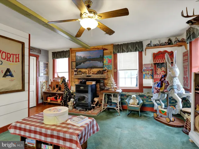 a patio with patio a table and chairs and potted plants