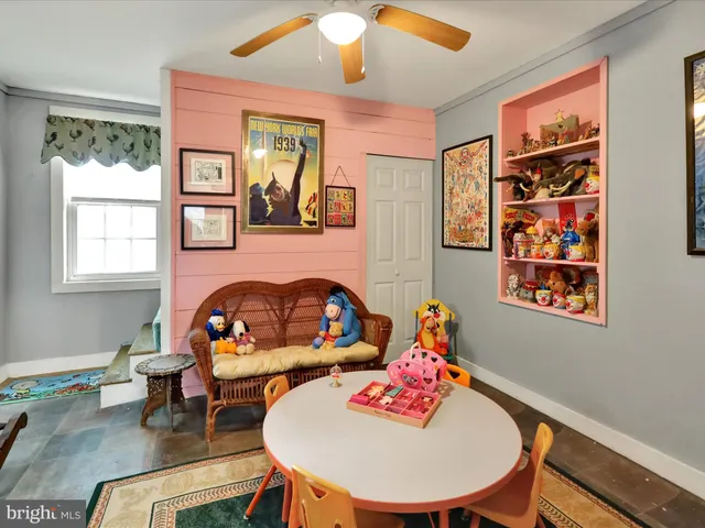 a view of a dining room with furniture and a window