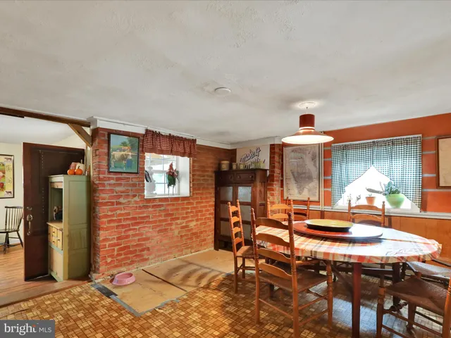 a bathroom with a toilet a sink and a mirror