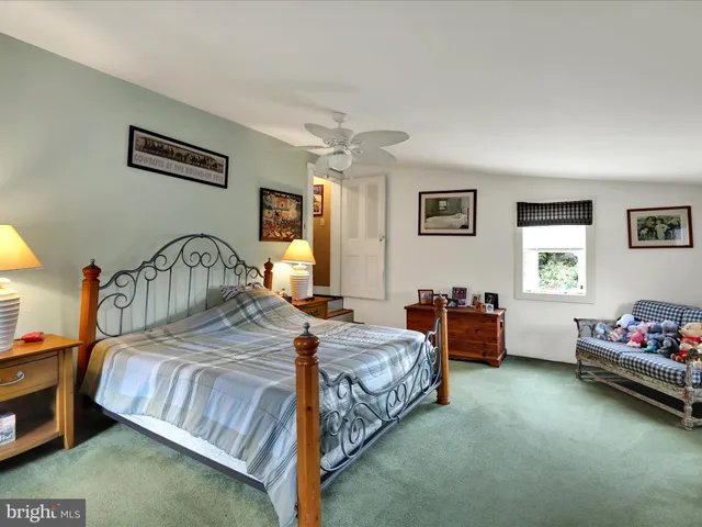 a view of water heater room with stairs