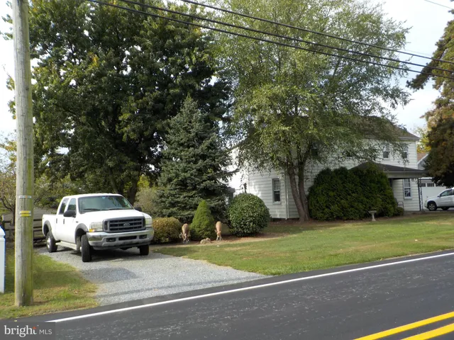 a view of a car parked in front of a house
