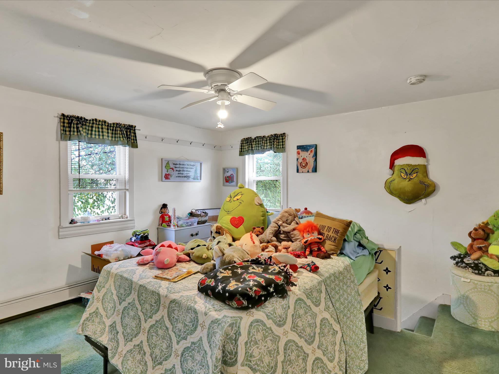 1443 Shumaker Road Manheim, PA 17545 - Photo 32 of 71 a bed room with a bed and a chandelier