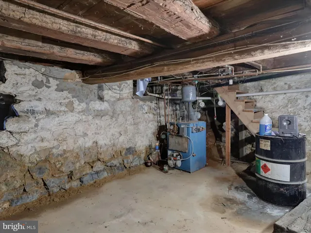 an aerial view of residential house with outdoor space and trees all around