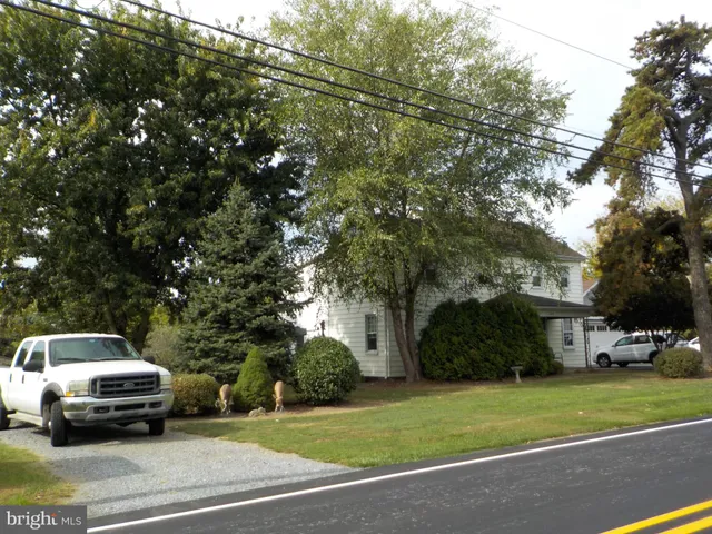 a house with trees in the background