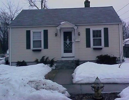 37 Gilman Street Springfield, MA 01118 - Photo 1 of 1 a front view of a house with two chairs